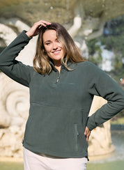 Woman wearing the Sugarloaf Fleece in Pine Green 