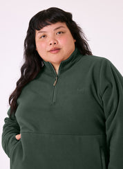 Woman wearing the Sugarloaf Fleece in Pine Green