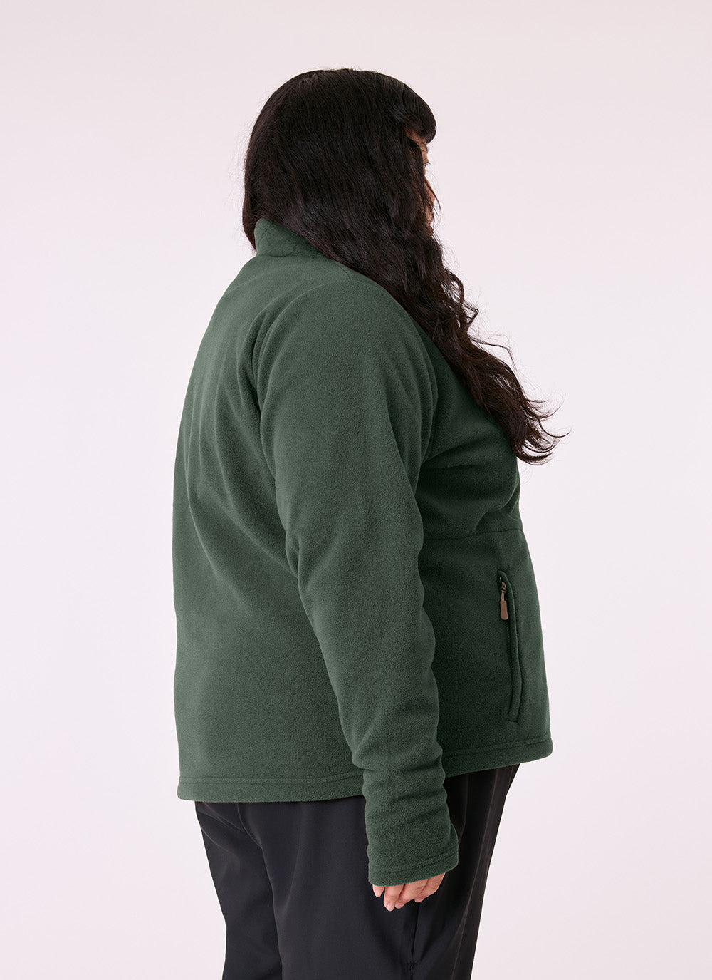 Woman wearing the Sugarloaf Fleece in Pine Green