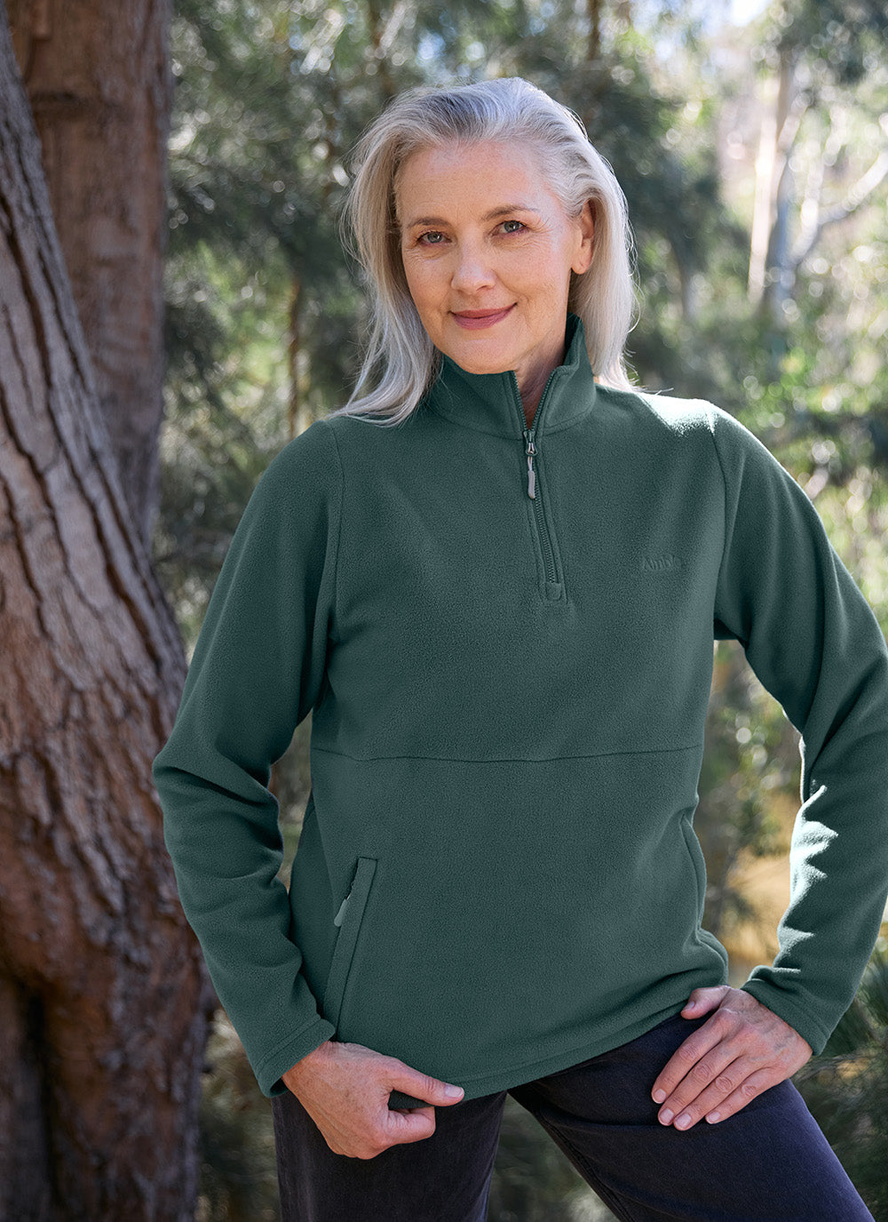 Older woman wearing the Sugarloaf Fleece in Pine Green
